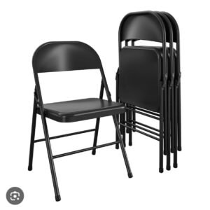 Durable black folding event chair with steel frame and contoured backrest available for hire from Pristine Nest Events in Norfolk and Suffolk.