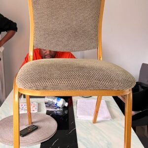 Gold frame banquet chair with cushioned beige upholstery available for hire from Pristine Nest Events in Norfolk and Suffolk.